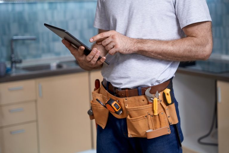 Plumber using tablet