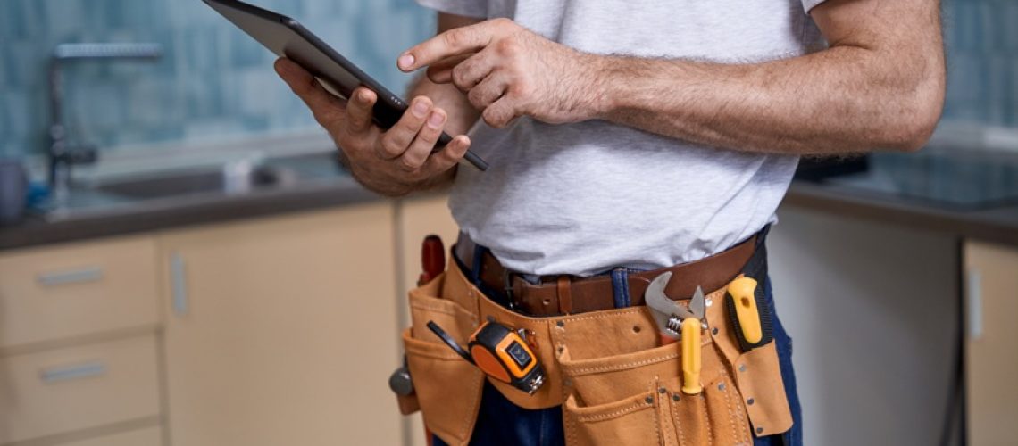 Plumber using tablet