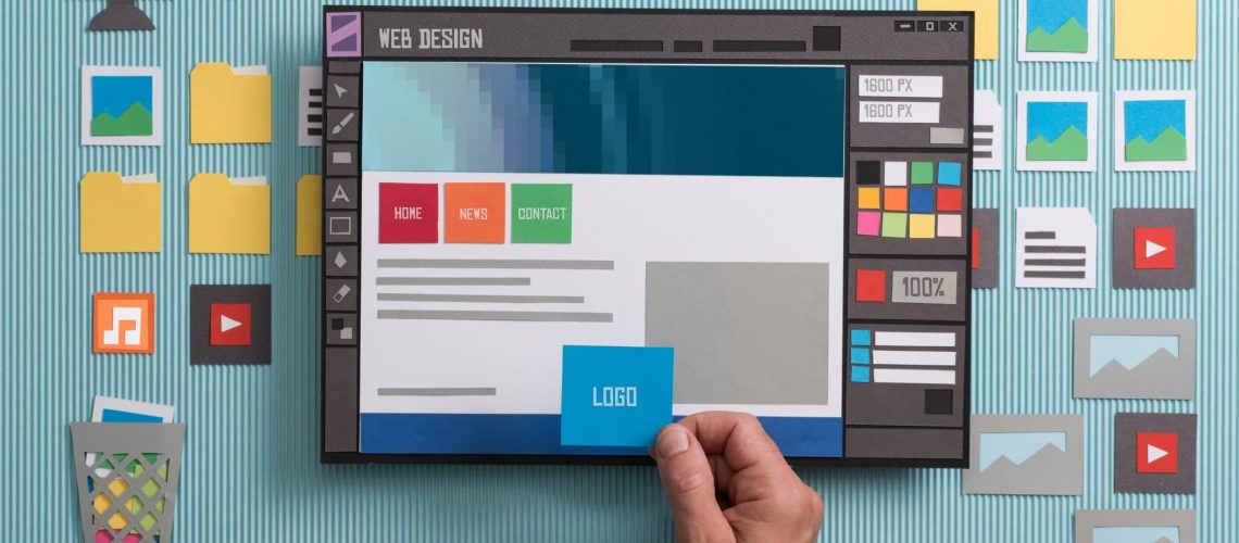 Web designer drafting web templates and web page layouts using a professional software, collage and paper cut composition